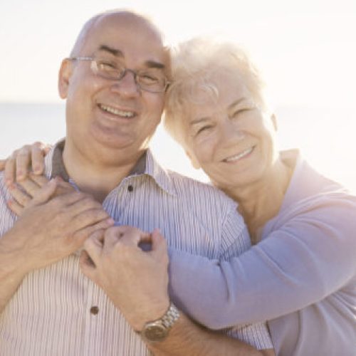 Portrait of seniors in love on the beach